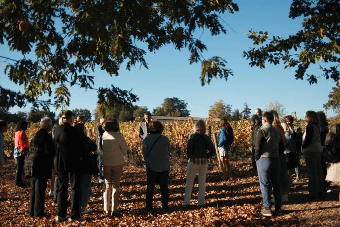 A group of people stands in a field