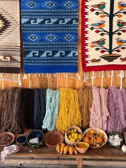 A vibrant display of colorful wool rugs