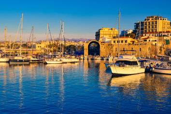 A clear blue sky dotted with a few fluffy white clouds.