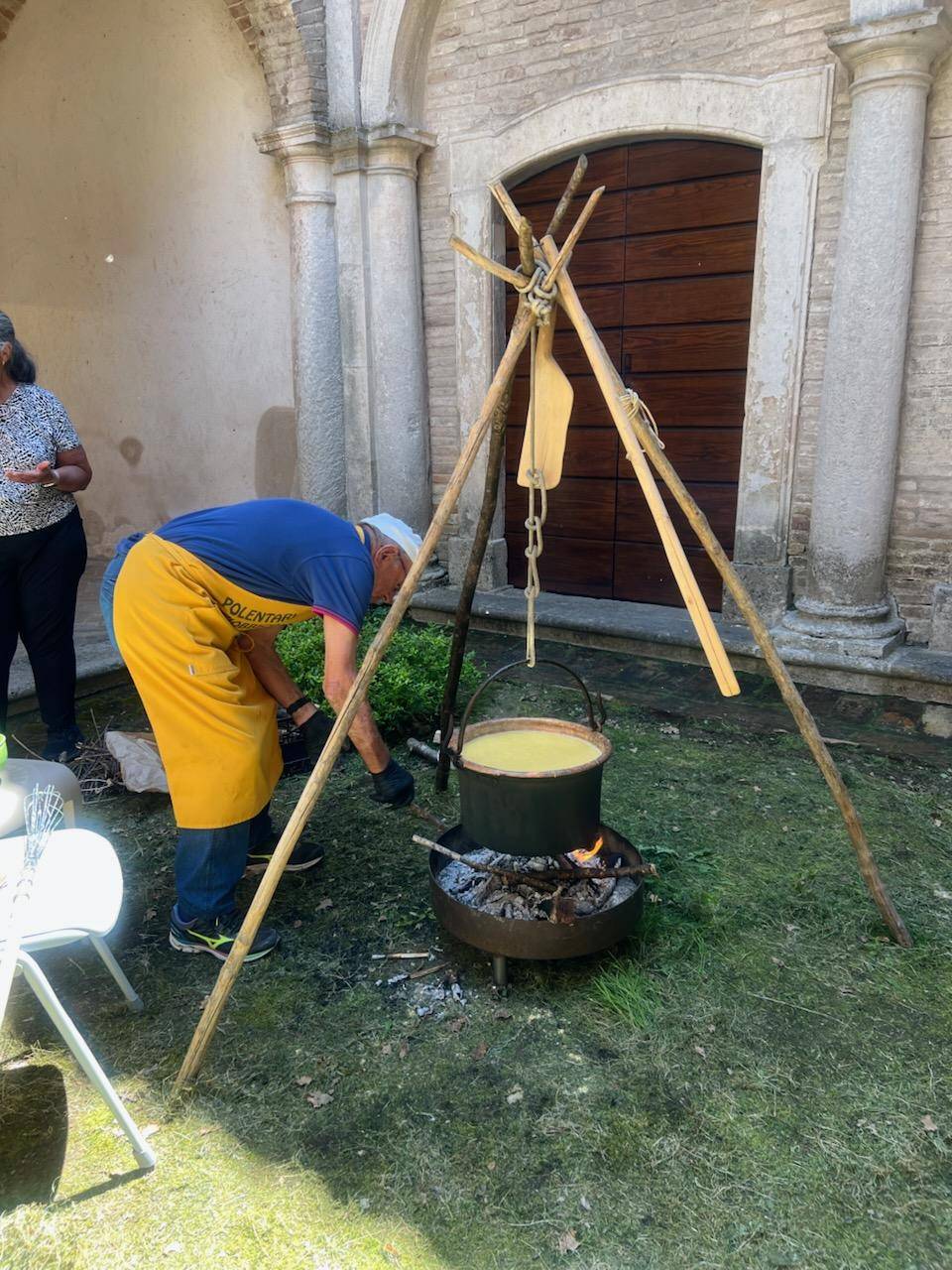 A man grilling food outdoors