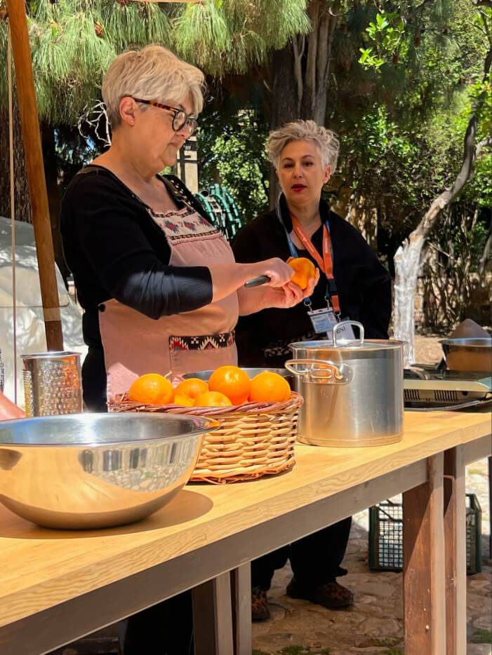 A woman is chopping vegetables