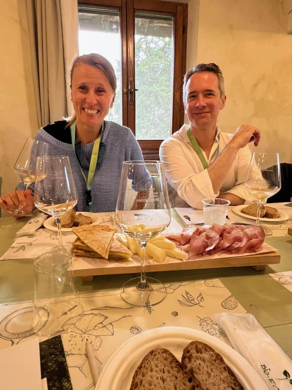 Two friends sharing a meal at a table