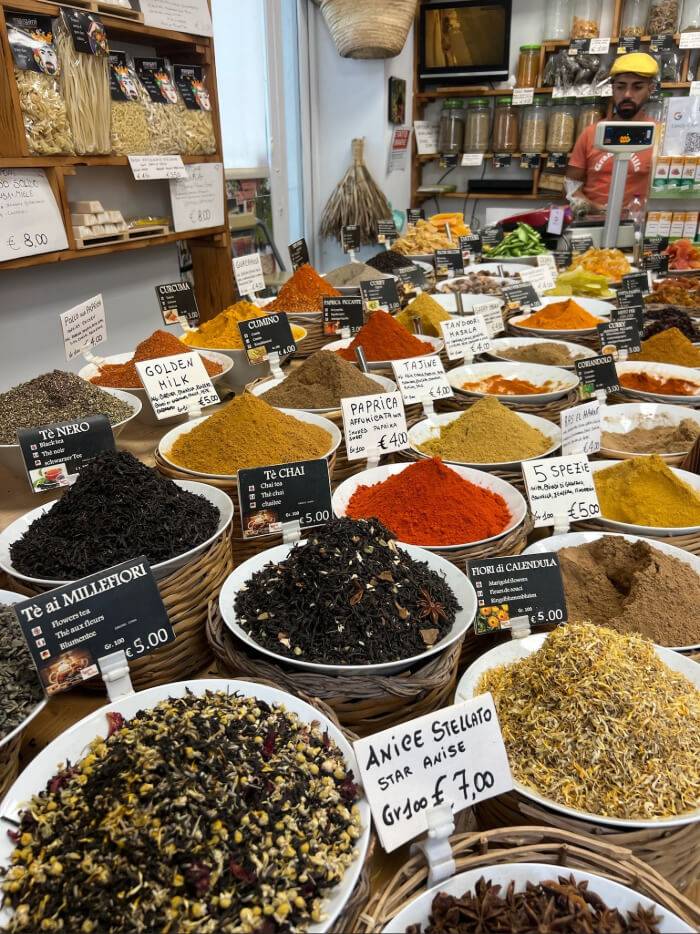 A large assortment of spices and herbs in containers