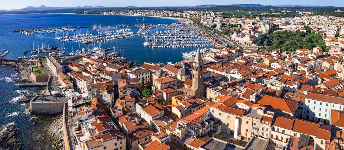 Aerial view of a coastal town with a marina