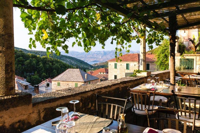 A restaurant's terrace with tables and chairs