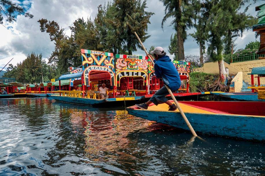 A vibrant canal scene with colorful boats