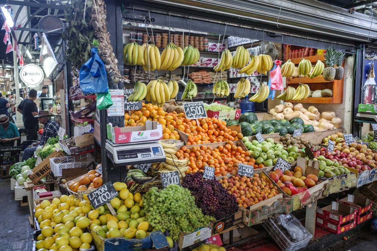 A lively market featuring an array of fruits and vegetables