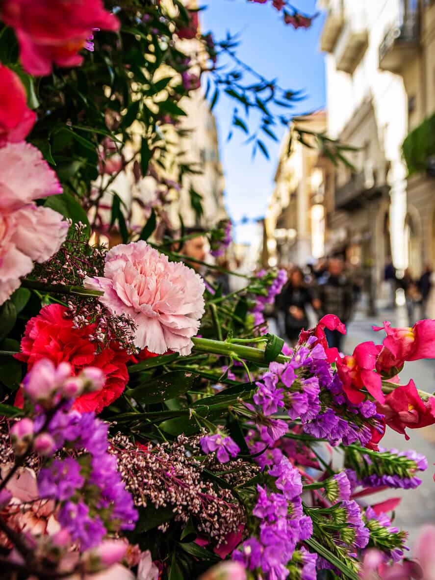 A vibrant bouquet of flowers displayed on a street corner