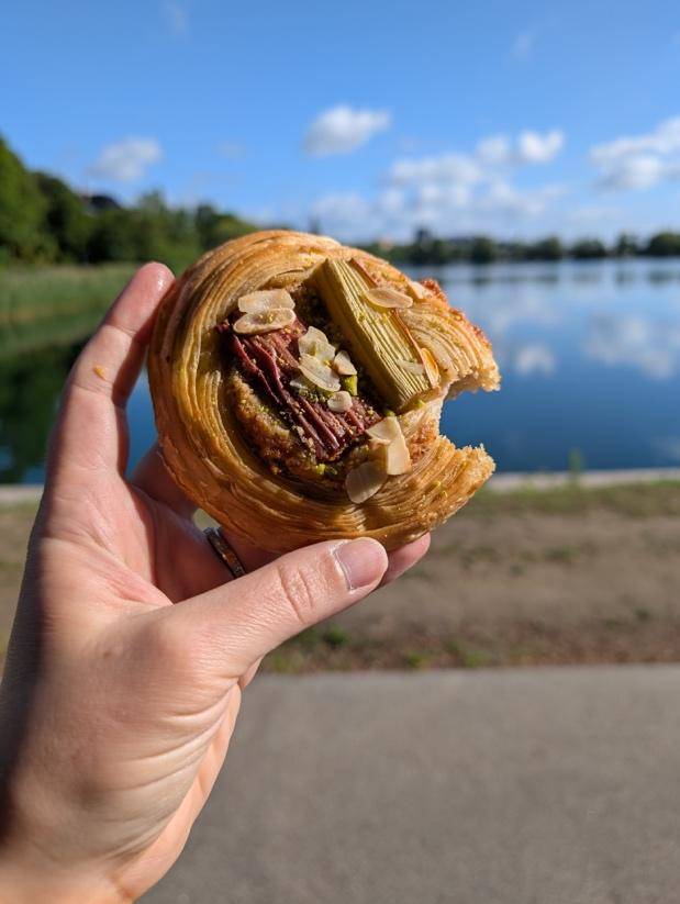 Close-up of a hand gripping a pastry