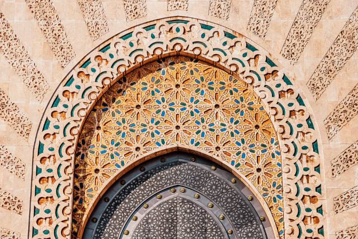 Intricately designed archway with blue and gold patterns