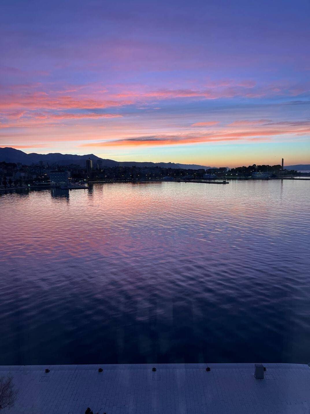 A serene sunset view from a boat in Croatia